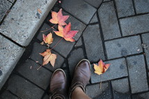 boots on a sidewalk in fall 