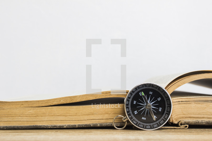 open book and compass 