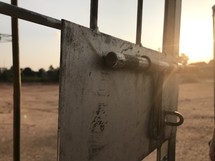 sunlight on a gate door 
