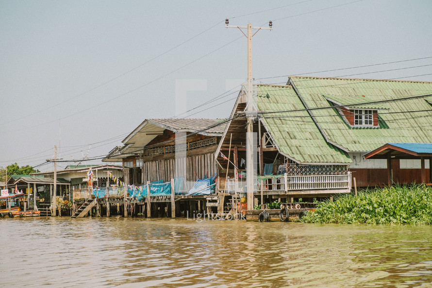 houses along a river in Thailand 