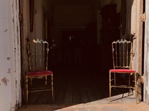 vintage chairs in a doorway 