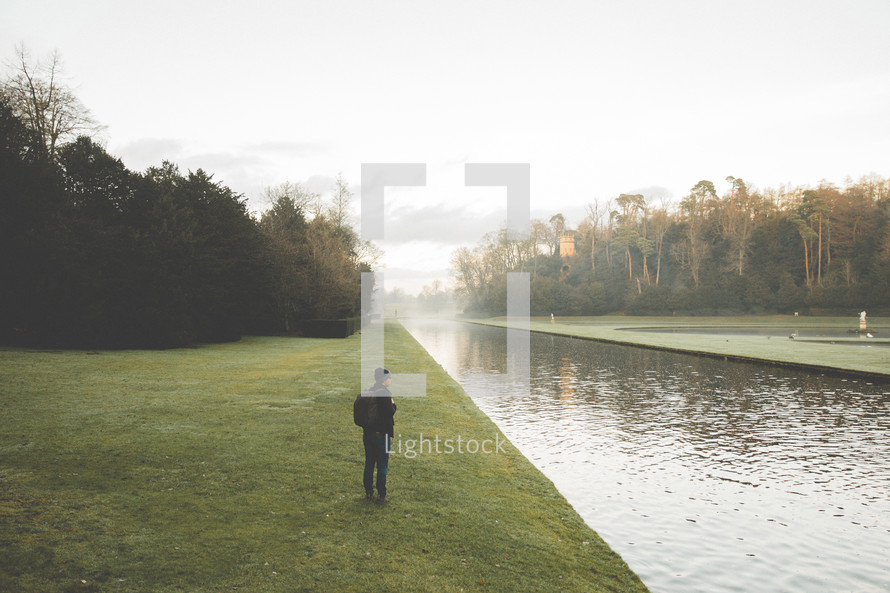 person standing on a shore of a river in Yorkshire 