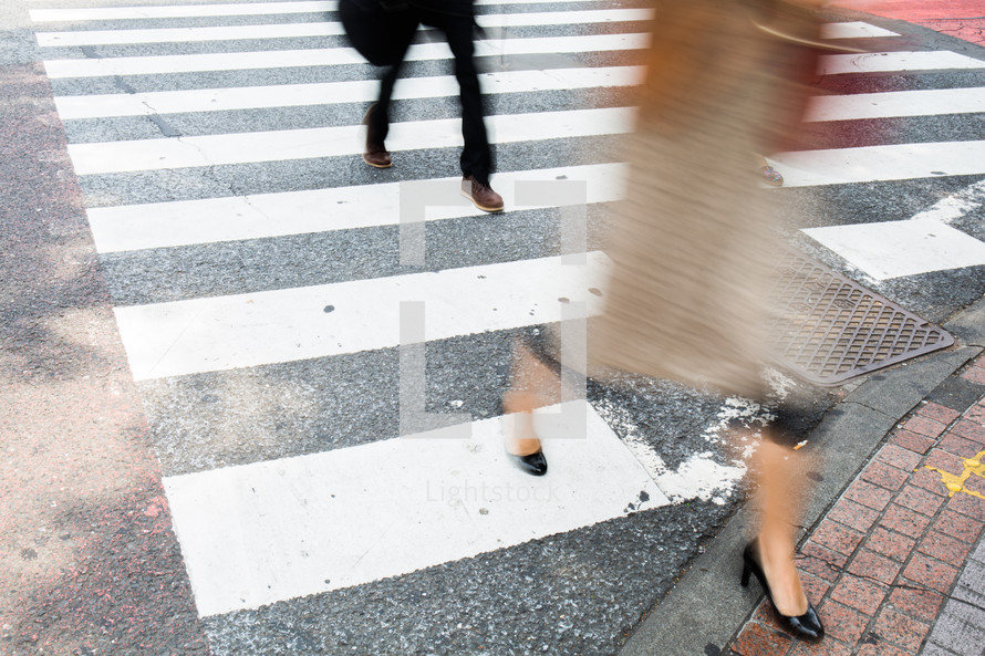 people crossing a crosswalk 