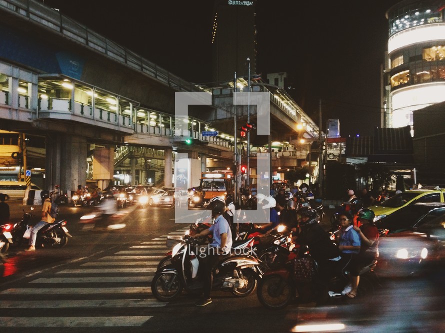 motorcycles on a busy city street at night