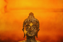 A gold Buddha figurine. 