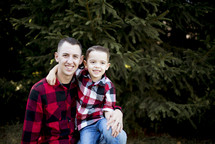 father and son in plaid shirts 