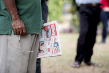 man holding a newspaper 