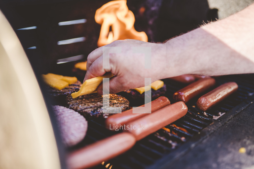 grilling hamburgers and hotdogs 