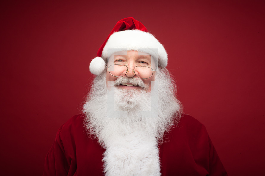 headshot of a smiling Santa 