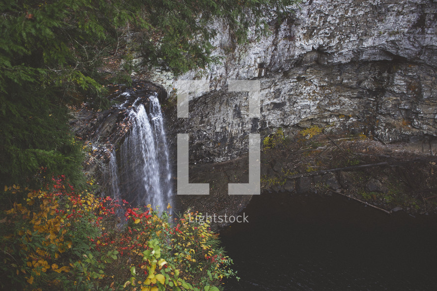 waterfall off the side of a cliff in fall 