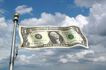 A one dollar bill as a flag on a flagpole against the sky.