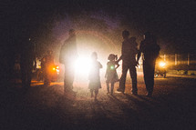 silhouette of a family walking 
