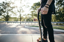 a teen with a skateboard 
