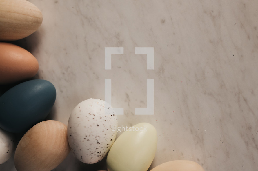 wooden Easter eggs on a marble background 
