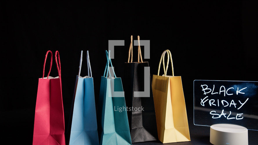 Composition of shopping bags in shop for Black Friday
