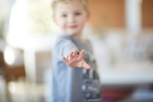 a toddler's reaching hand 