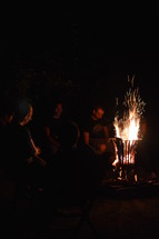 people around a campfire 