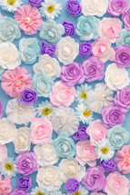 Bed of white pink and blue Flowers flay layer background