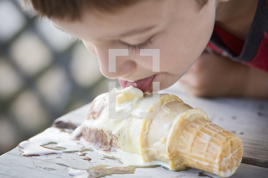licking a dropped ice cream cone 