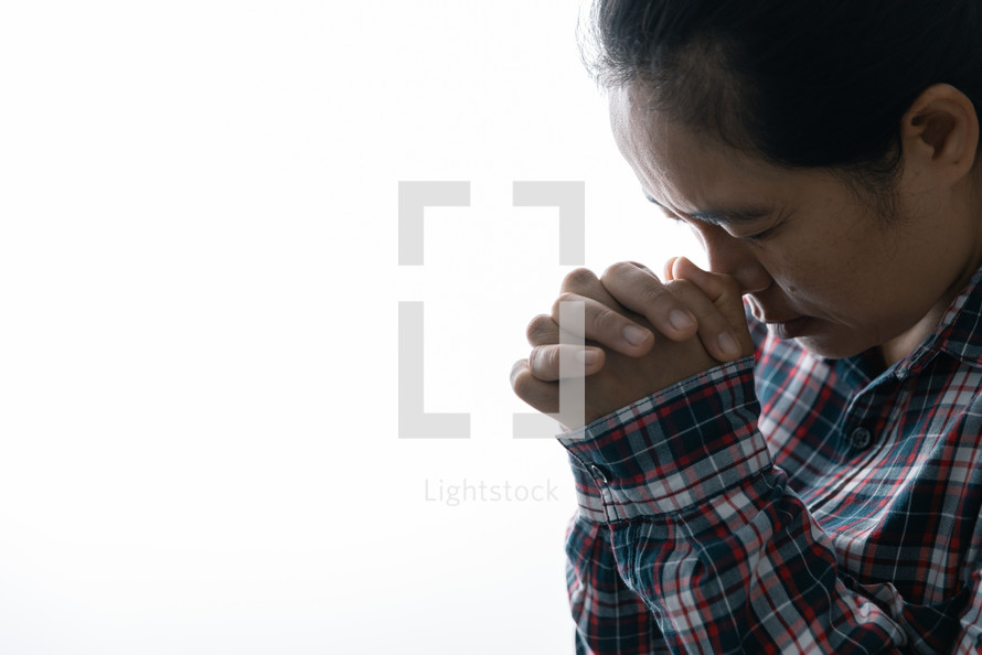White background and praying hands