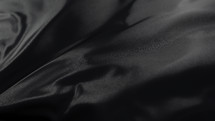 black wrinkled fabric background 
