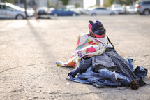 a pile of clothes on a road 