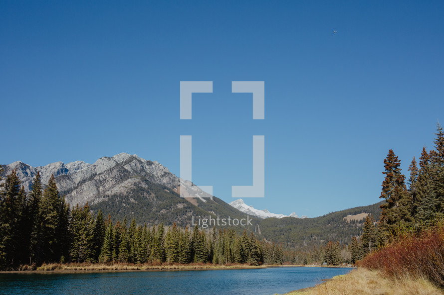 lake, mountains and evergreen forest 