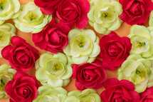 Bed of red and green Flowers flay layer background