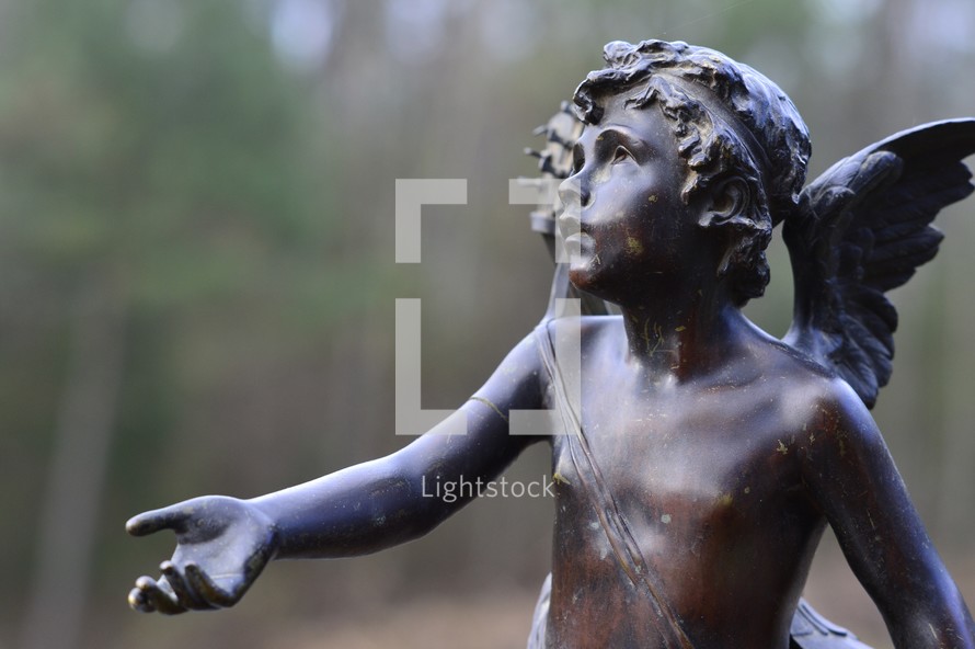 angel statue with reaching arm 