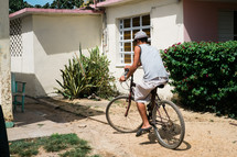 a man on a bicycle on a dirt path in Cuba 