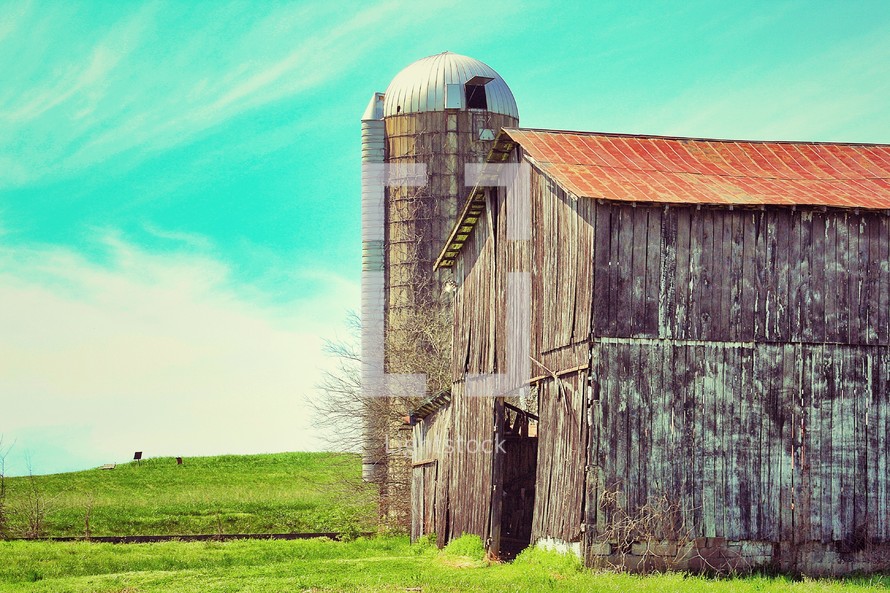 old weathered barn and silo