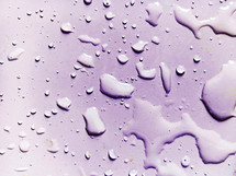 Violet Water Droplets Symbol of life and water creation sea lakes ocean background image