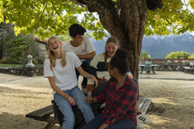 Group of young adults laughing together