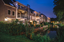 residential buildings in the evening by the canal