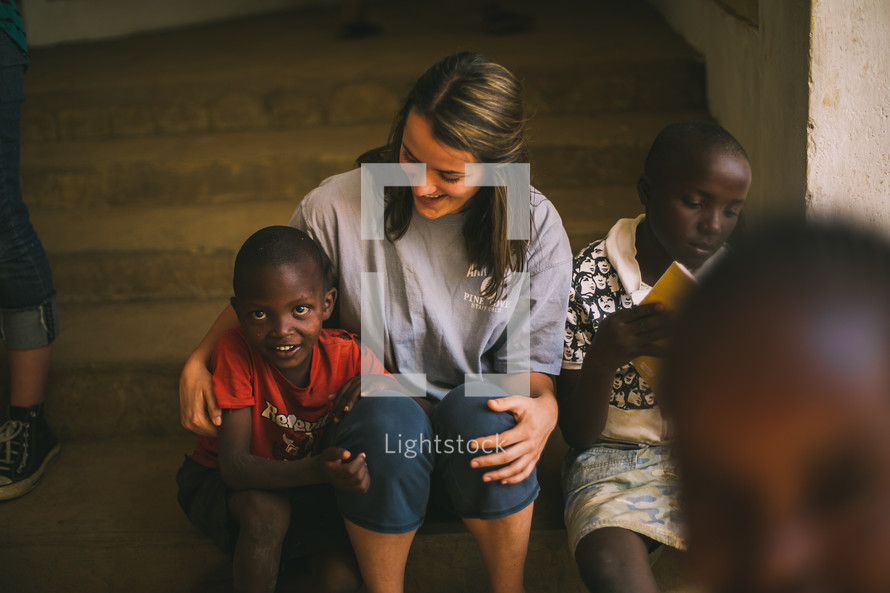 missionary hugging a child in Kenya