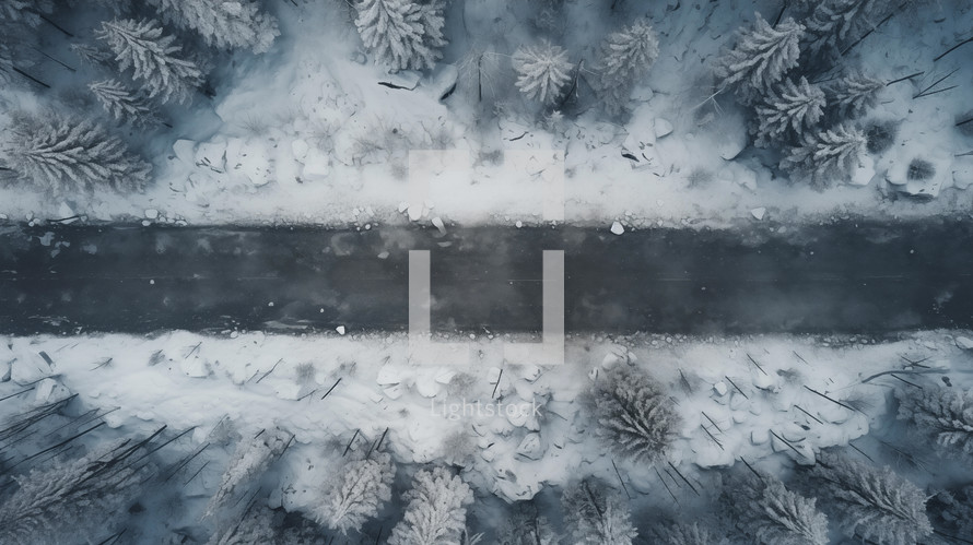 Top view of a path through a snowy forest. 