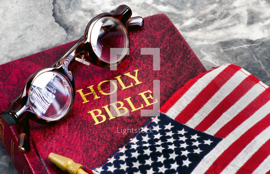 spectacles, Holy Bible, and American flag 