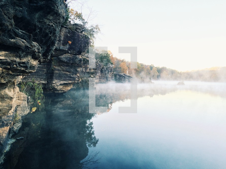morning mist rising from a lake 