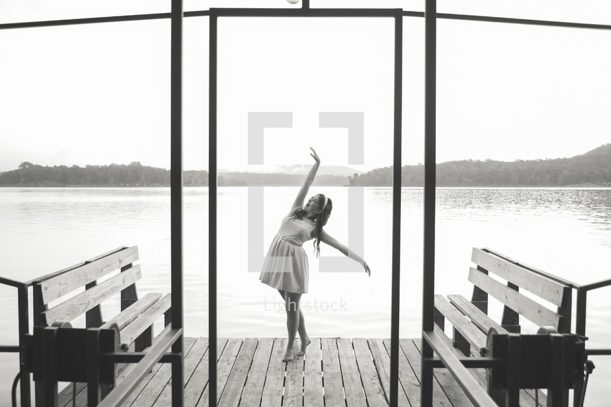 woman dancing on a dock 