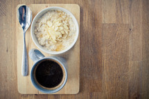 Porridge Almonds and Honey and a coffee mug 