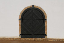 closed doors in an arched doorway