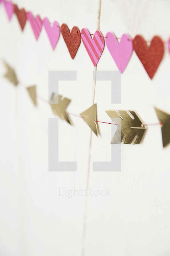 hearts and arrows banner on a white wall 