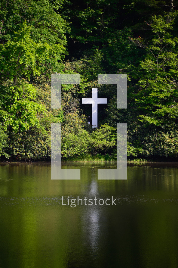 white cross in the woods 