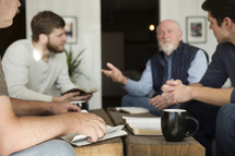 men in discussion at a Bible study.