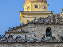 Doves on the roof of the church in Athens