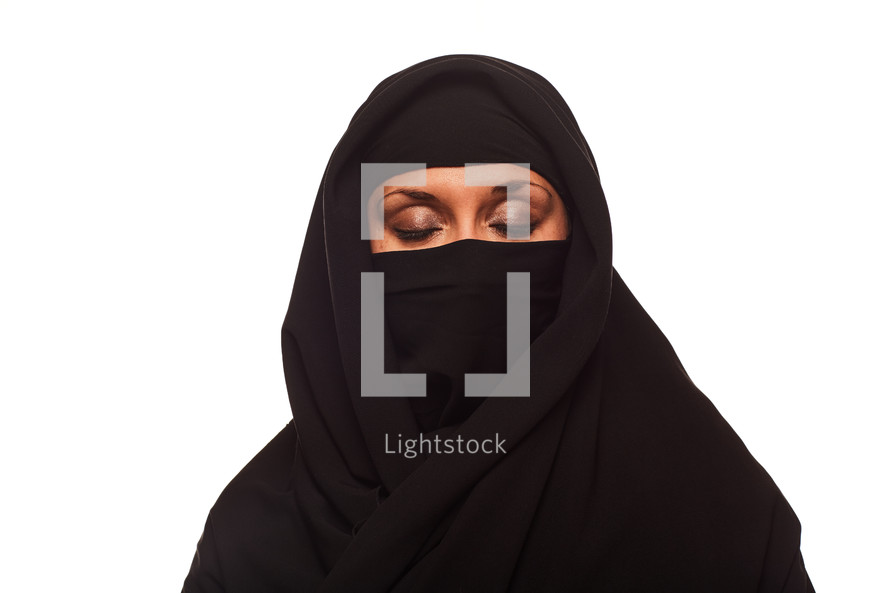 A Muslim woman with eyes closed 