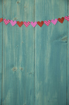 hearts on a teal wall 