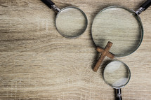 magnifying glasses and cross 