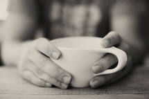 hands holding a mug 