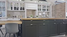 Tracking shot of a large luxury kitchen with grey and white classic design